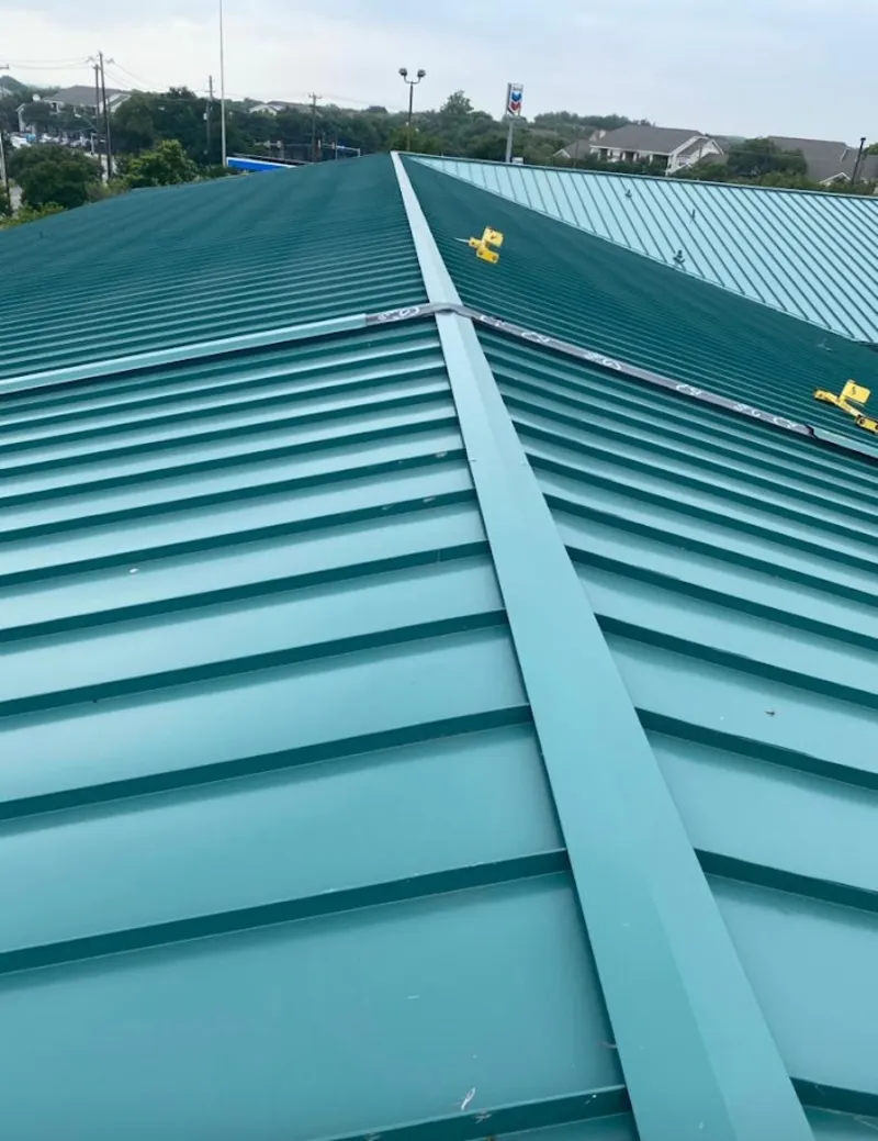 Green commercial metal roof ridge and valley for Metal Roof Repair in Middleborough
